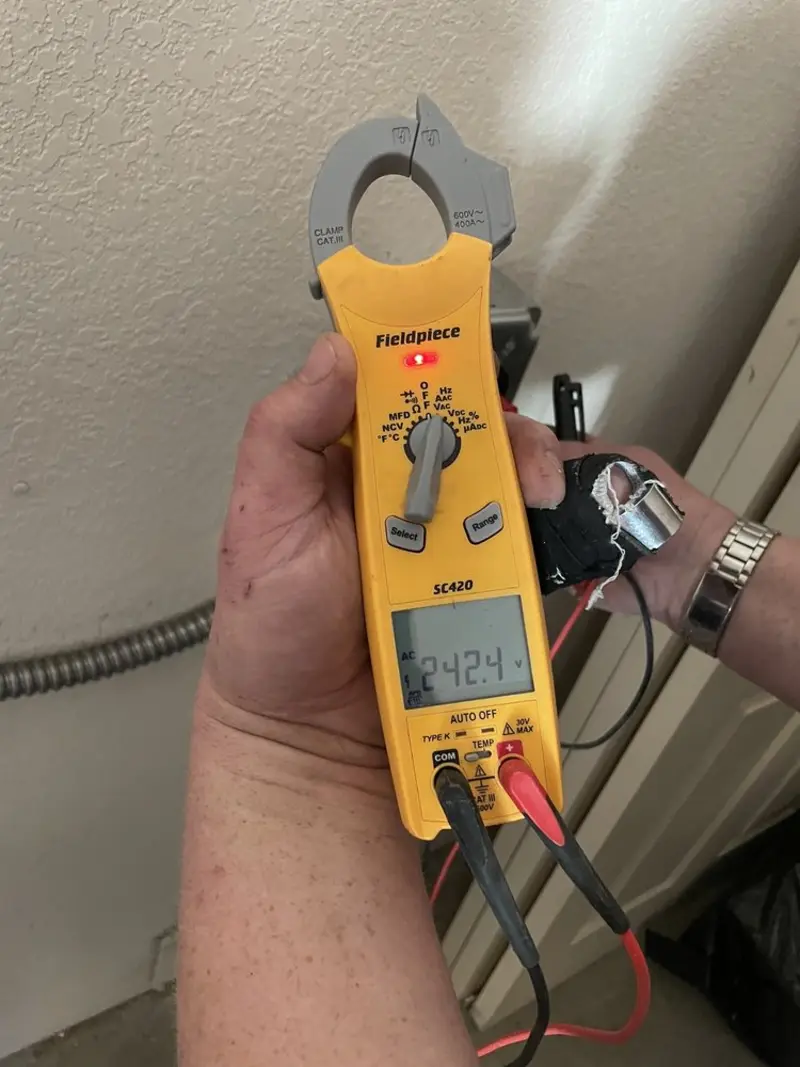 Voltage testing with clamp meter during Aluminum Wiring Replacement in Wellsville